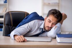 Businessman sleeping at his desk