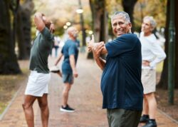 Happy seniors exercising outdoors