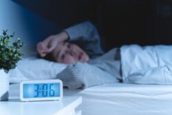 Woman lying awake at night due to anxiety
