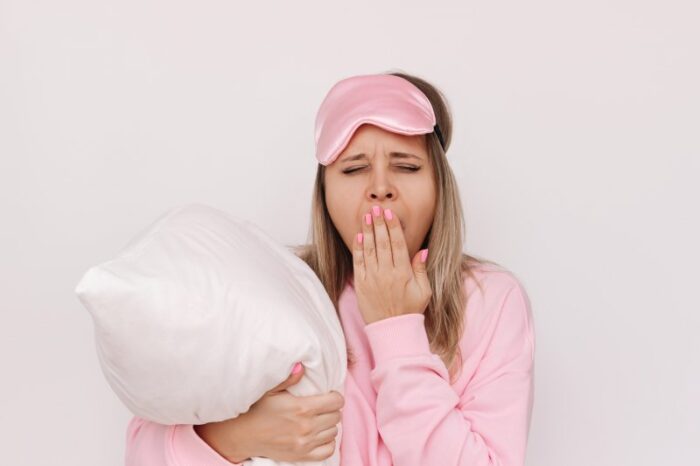 tired woman in pajamas